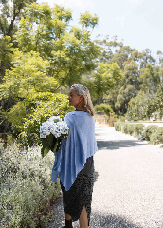 Lou Lou Australia Carrie Cashmere & Bamboo Knit Poncho in Persian Jewel, featuring a soft, vibrant blue tone.