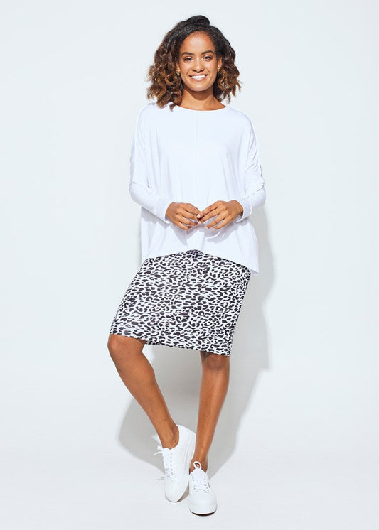 Lou Lou Australia Stella Longsleeve Oversized Bamboo Slouch Top in white paired with a black and white leopard print skirt.