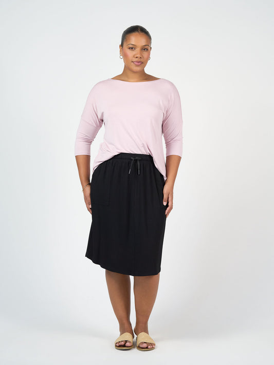 Lou Lou Australia Lee Bamboo Skirt with Pockets in black, featuring a drawstring waist and practical pockets.