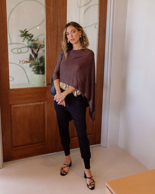 Lou Lou Australia Carrie Cashmere & Bamboo Knit Poncho in Chicory Coffee, styled as an asymmetrical multi-way wrap.