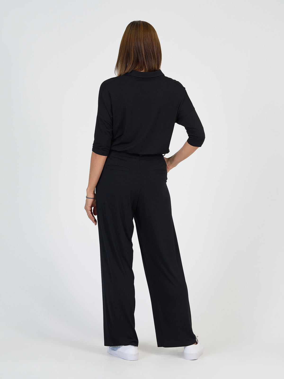 The Day Shift Set by Lou Lou Australia—black bamboo long-sleeve top with matching black wide-leg dress pants.