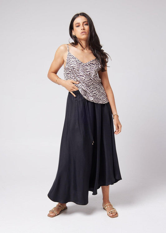 Lou Lou Australia Clover Sleeveless Silk Cami in Zebra print, made from silk, shown with a long black skirt.