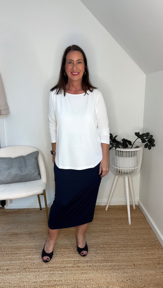 @salt.water.nomad wearing Lou Lou Australia white bamboo long sleeve top