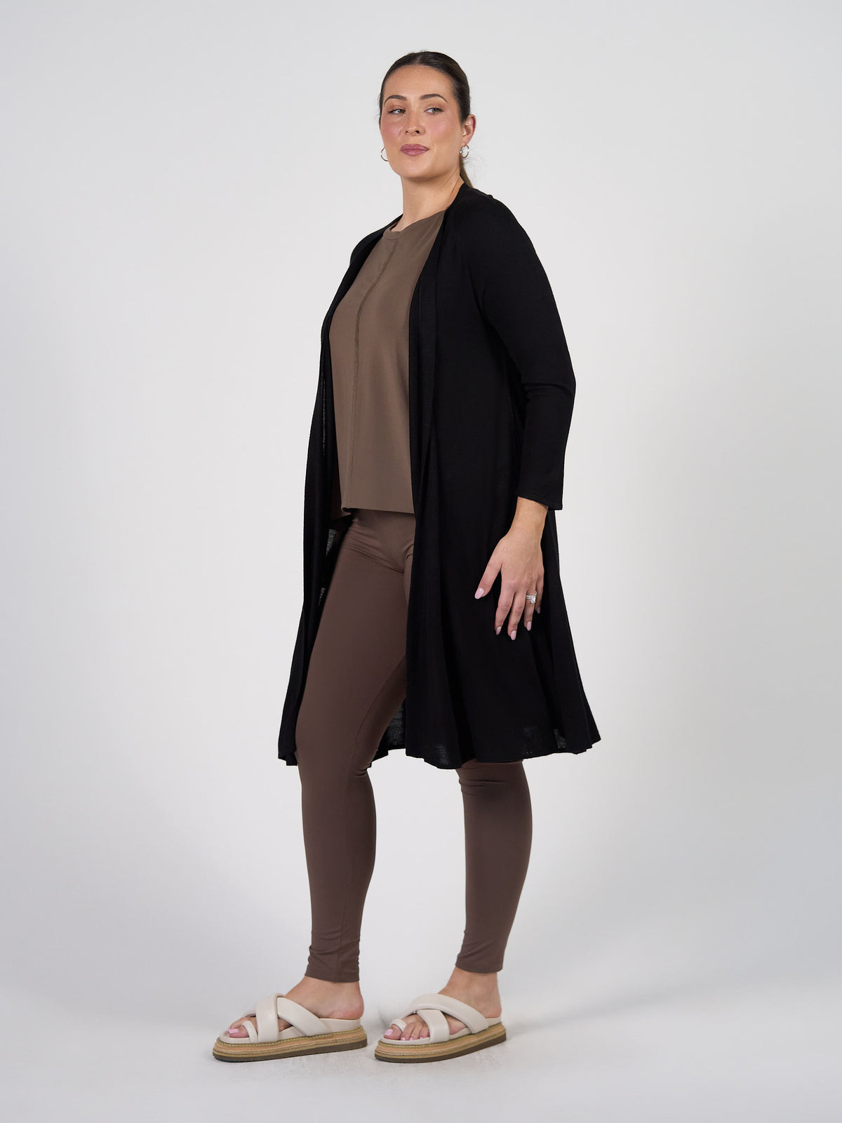 Lou Lou Australia Quatro Longline Bamboo Duster Cardigan in black, made from sustainable bamboo, shown with taupe and brown.