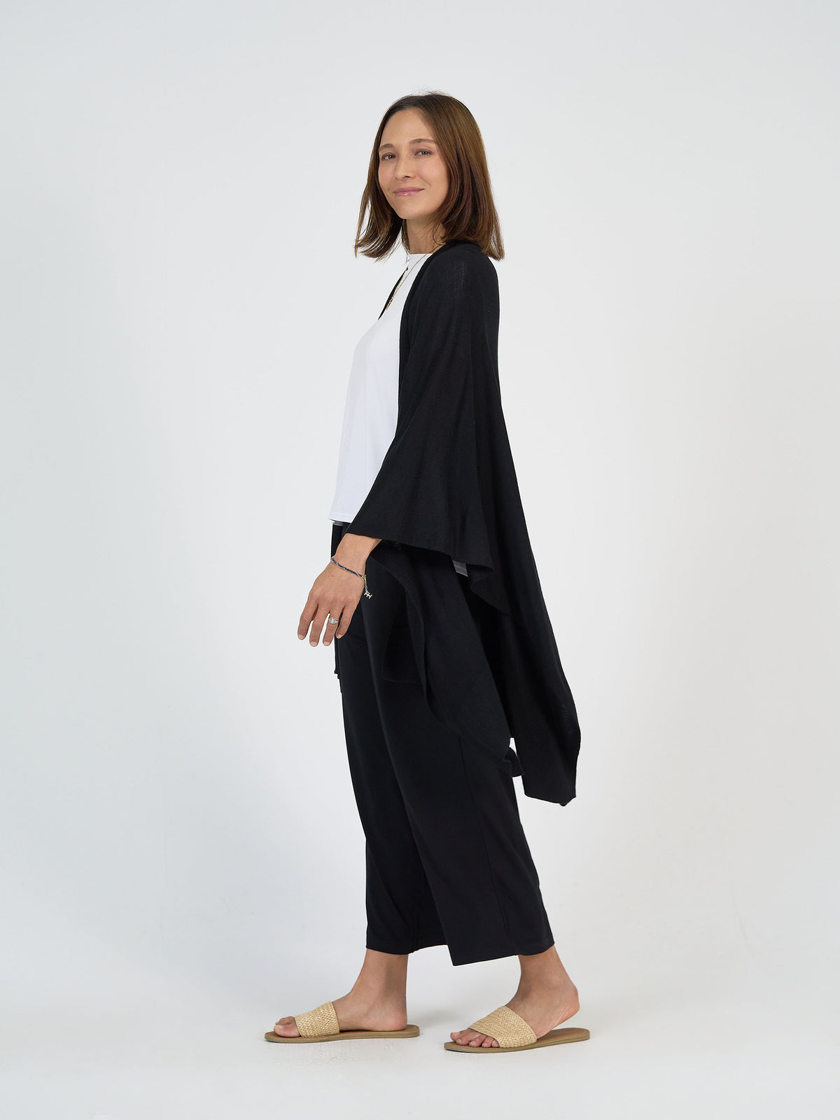 The Focus Day Set by Lou Lou Australia: white top, loose black bamboo open cardigan, and black pants.