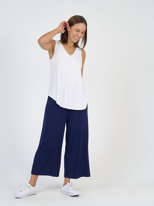 Lou Lou Australia’s The Garden Party Set: white bamboo sleeveless top with navy wide-leg bamboo pants.