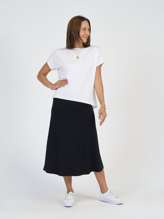 The City Break Set from Lou Lou Australia: white bamboo t-shirt and black bamboo midi skirt.