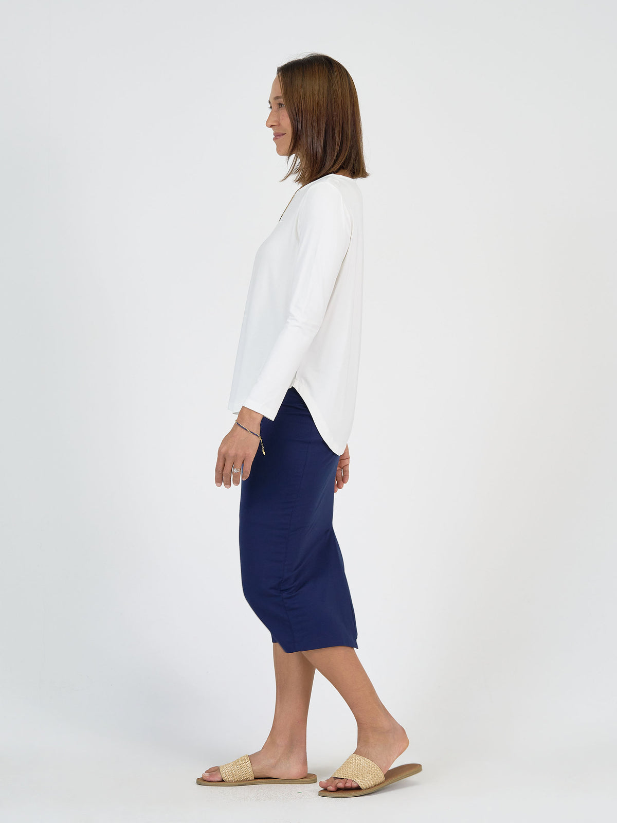 Lou Lou Australia “The Camera On Set” bamboo set: a white long-sleeve top with navy blue ankle-length maxi skirt.