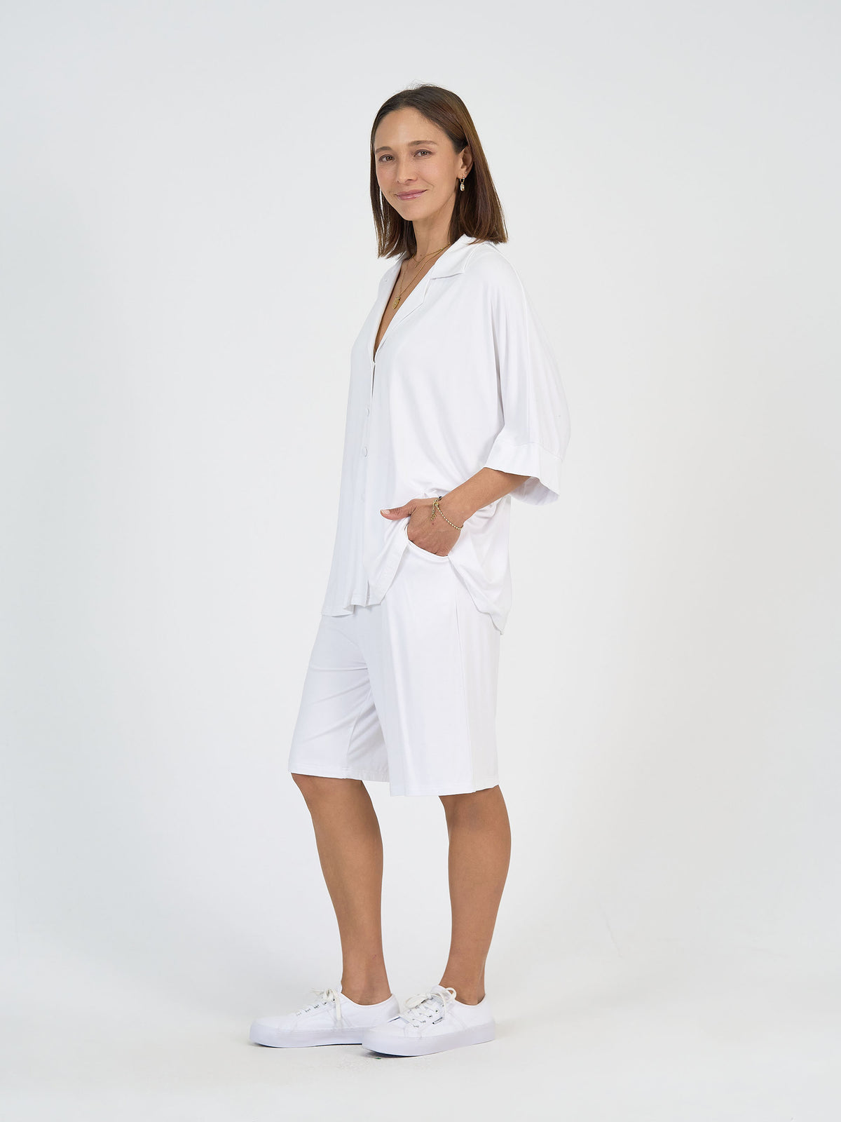 Lou Lou Australia The Cruise Set in white—loose bamboo button-up shirt and breathable, knee-length bamboo shorts.
