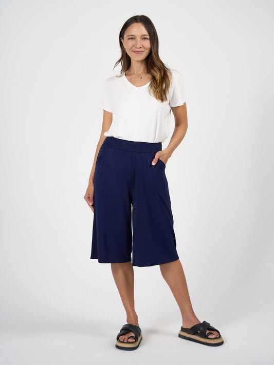 Lou Lou Australia The Culotte Set in bamboo, with a white short-sleeve top and navy blue culottes.