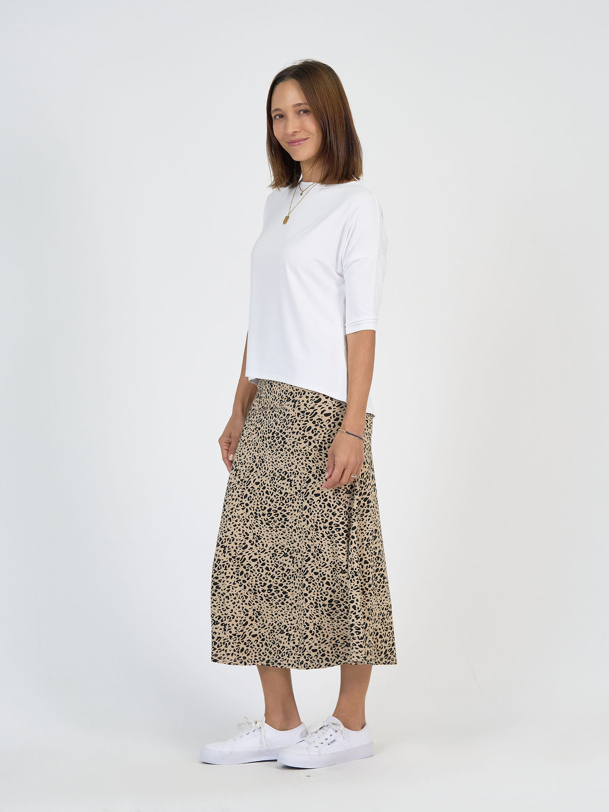The Spring Break Set by Lou Lou Australia features a bamboo white top and leopard print midi skirt.
