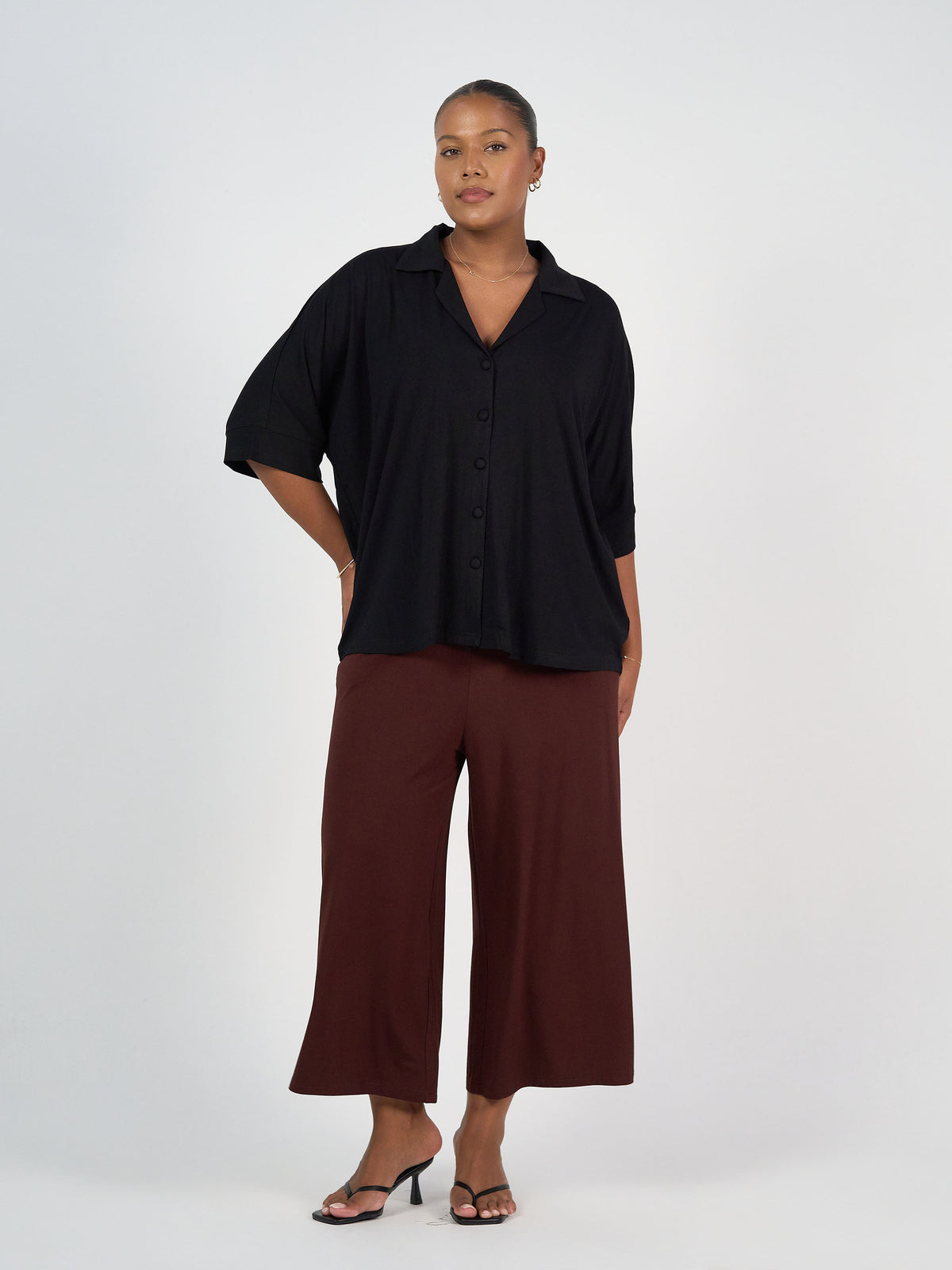 The Culotte Set by Lou Lou Australia: bamboo, black three-quarter sleeve button-up top and warm brown wide-leg pants.