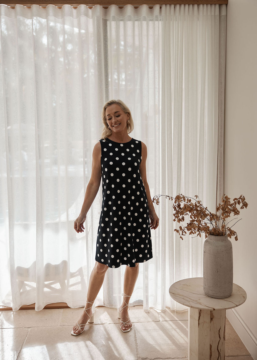 Lou Lou Australia Danity Bamboo Shift Dress - Polka Dot, sleeveless black A-line dress with white spots, made from bamboo.