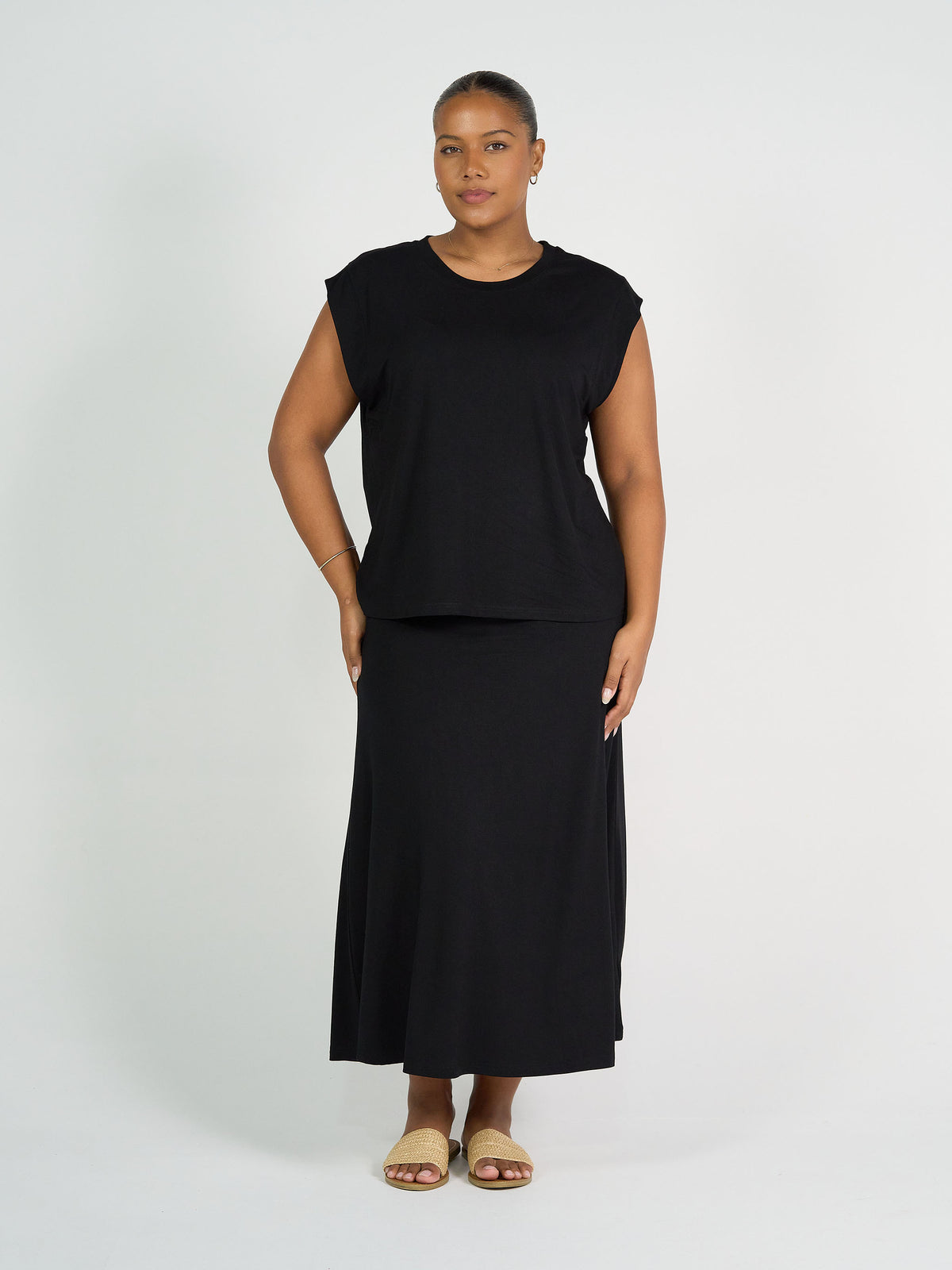 Lou Lou Australia Donna Cap Sleeve Bamboo Tee in black, made from bamboo fabric.