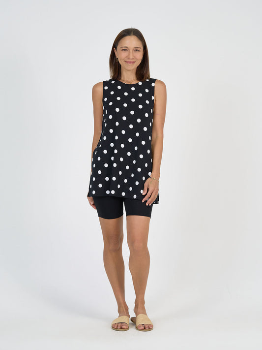 Lou Lou Australia Fantasia Bamboo Tunic Top in sleeveless A-line silhouette with white polka dots.
