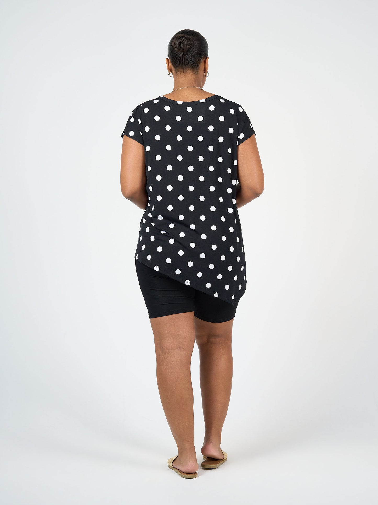 Lou Lou Australia bamboo asymmetrical Black top with white Polka Dots and black bike shorts
