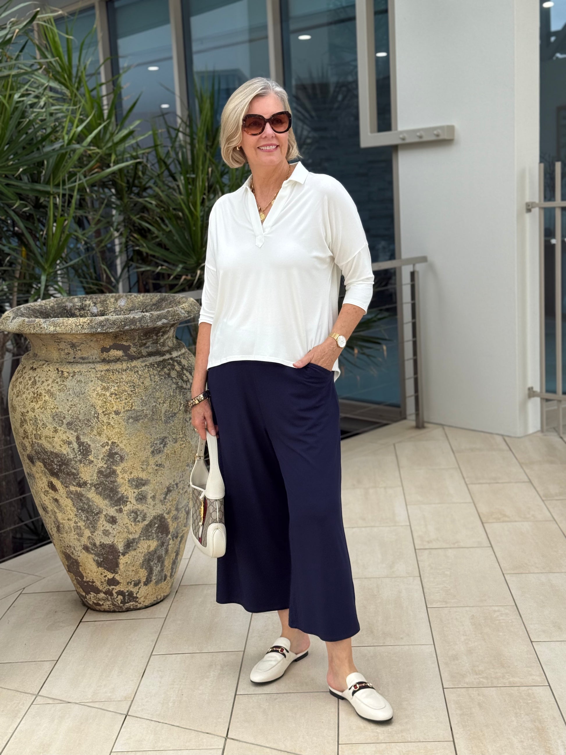 Lou Lou Australia Garden Party Set in bamboo, features a white top and navy wide-leg pants.