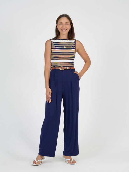 Lou Lou Australia bamboo high-waisted blue trousers with brown belt.