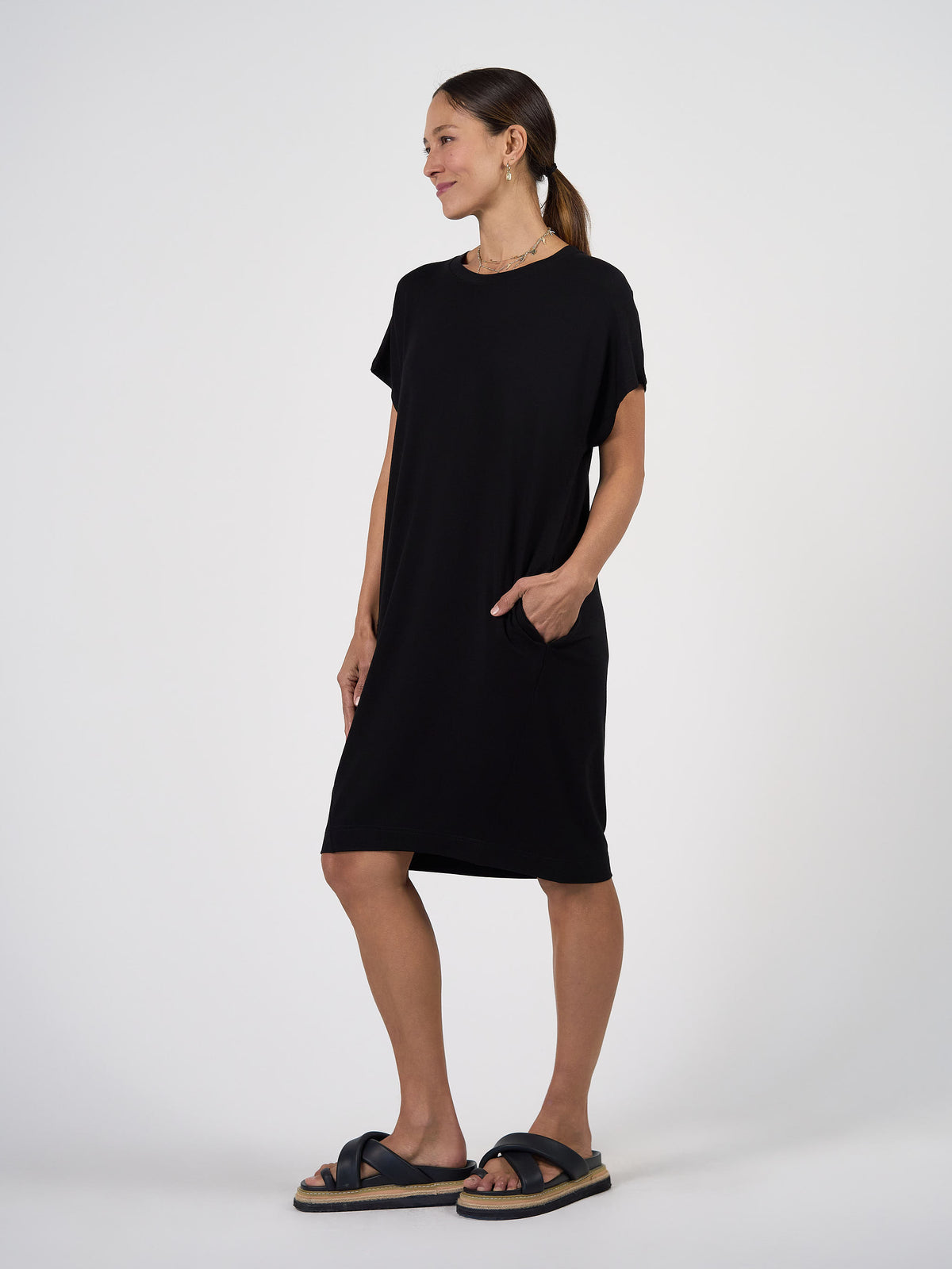 Lou Lou Australia Nicks Bamboo Short Sleeve T-Shirt Dress in black; knee-length with pockets and short sleeves.