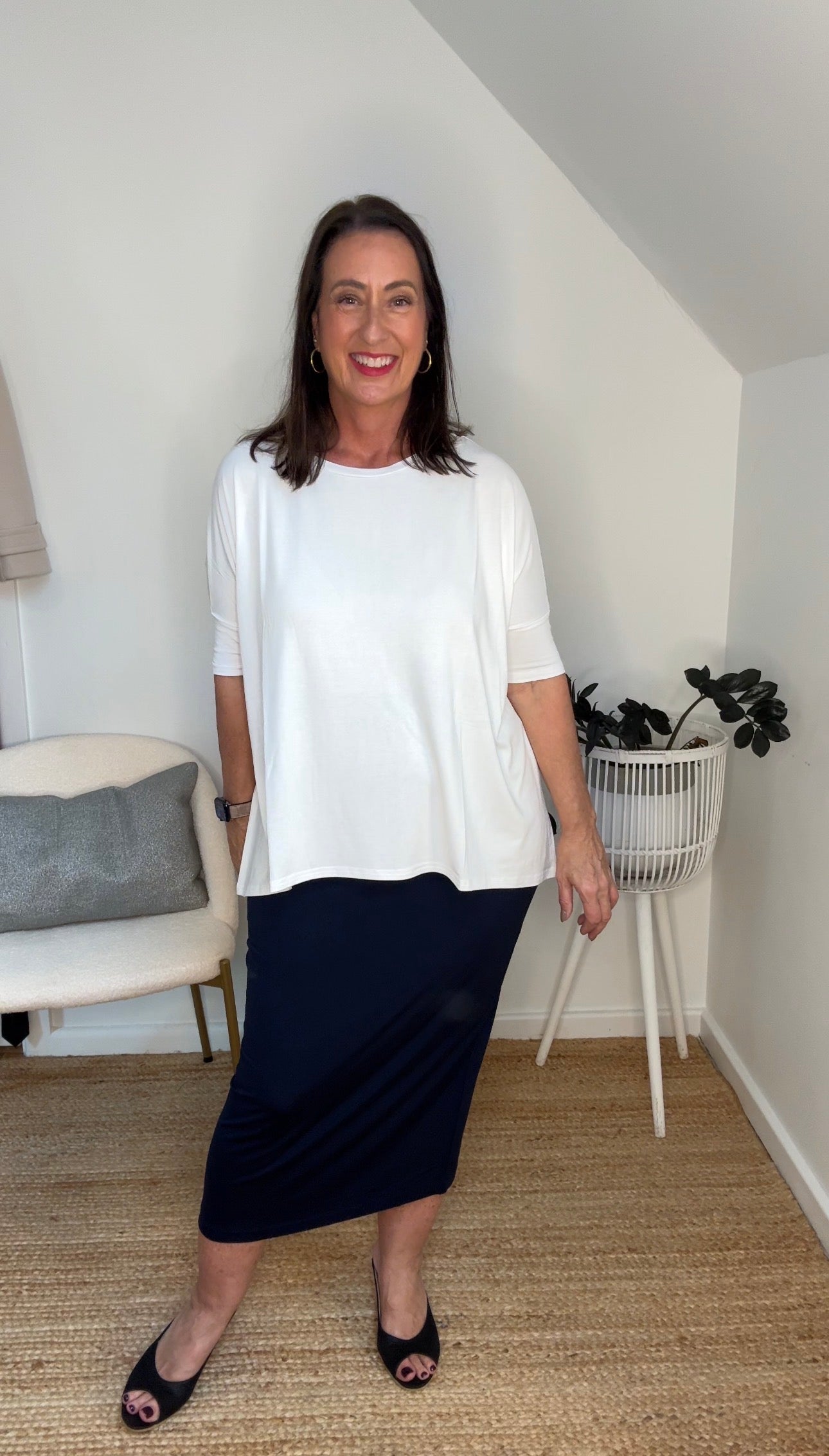 @salt.water.nomad wearing Lou Lou Australia white bamboo top and navy tube skirt