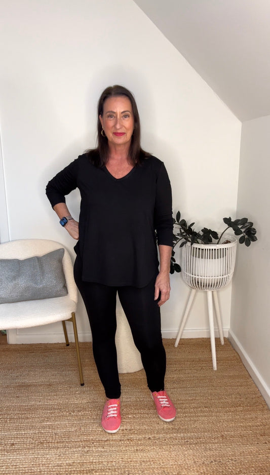 @salt.water.nomad wearing Lou Lou Australia black bamboo top