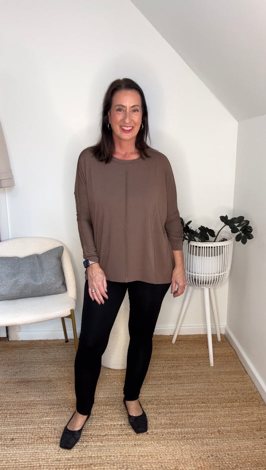 @salt.water.nomad wearing Lou Lou Australia black bamboo leggings with brown bamboo top