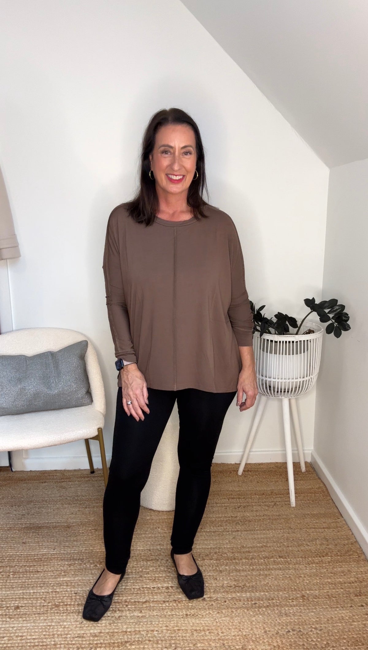 The Exposed Seam Set by Lou Lou Australia in bamboo features an oversized brown slouch top with black bamboo leggings.