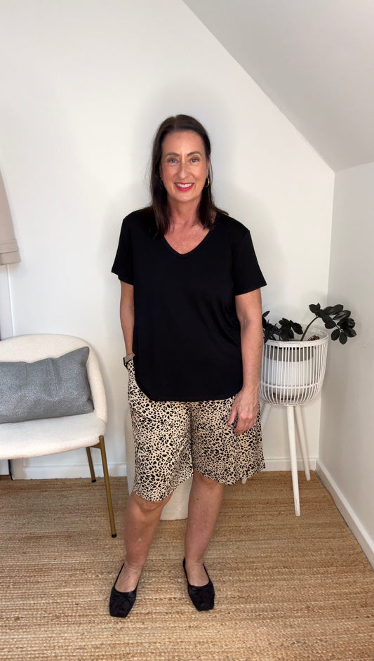 @salt.water.nomad wearing Lou Lou Australia leopard print bamboo shorts