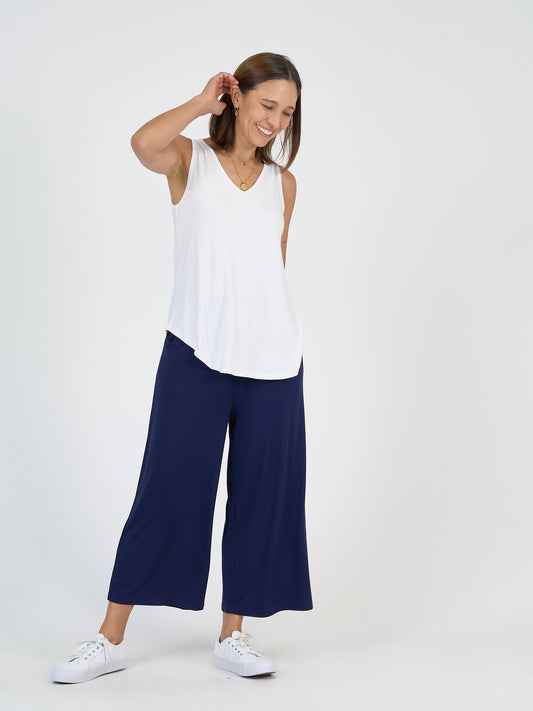 Lou Lou Australia bamboo wide-leg navy pants paired with a sleeveless white top.