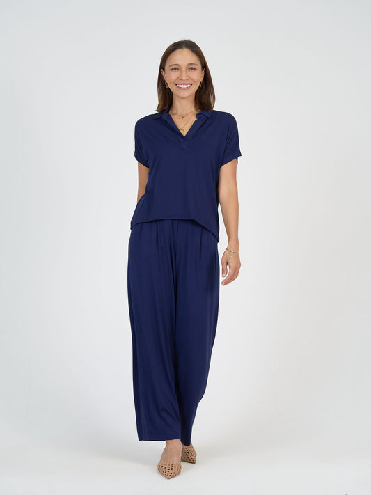 Lou Lou Australia Rush Bamboo Short Sleeve Collared Polo Top in navy with matching wide-leg bamboo pants.