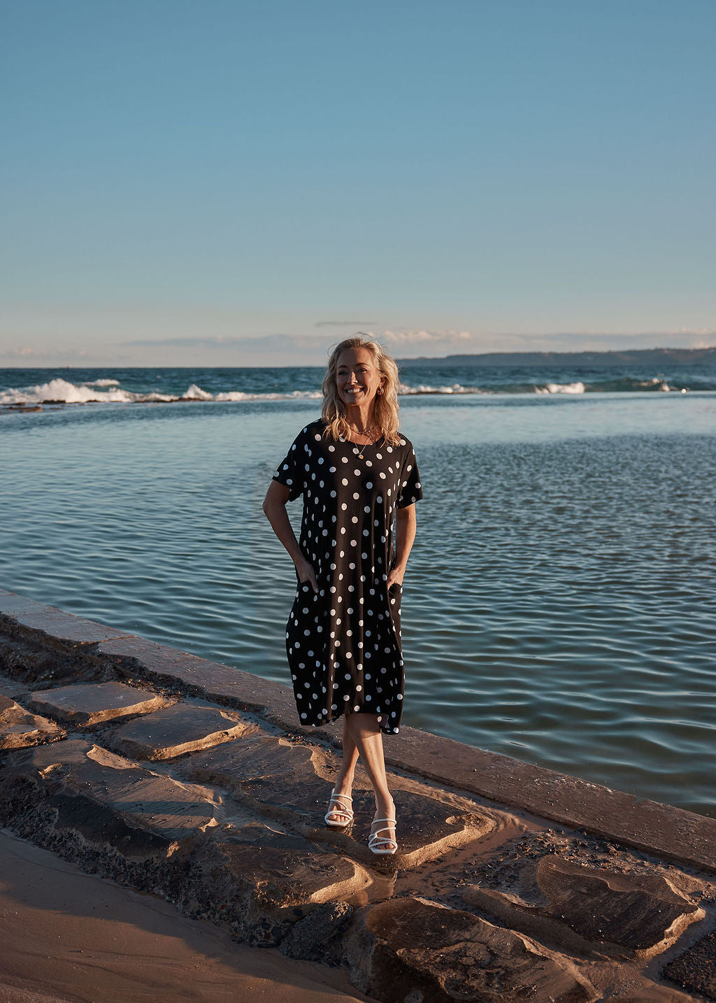 Lou Lou Australia Sade Bamboo Oversized T-Shirt Midi Dress in black and white polka dot print with hidden pockets.