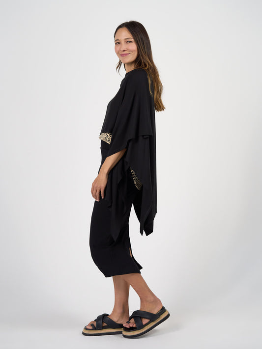 Lou Lou Australia Supreme Bamboo Travel Wrap in black, showcasing its soft bamboo fabric and classic draped design.