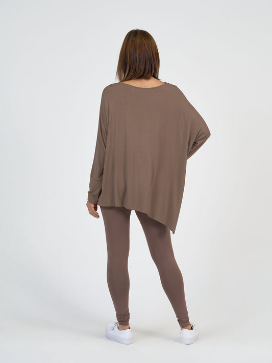 Lou Lou Australia Susie Oversized Asymmetrical Bamboo Top in Chocolate, styled loosely with matching brown bamboo leggings.