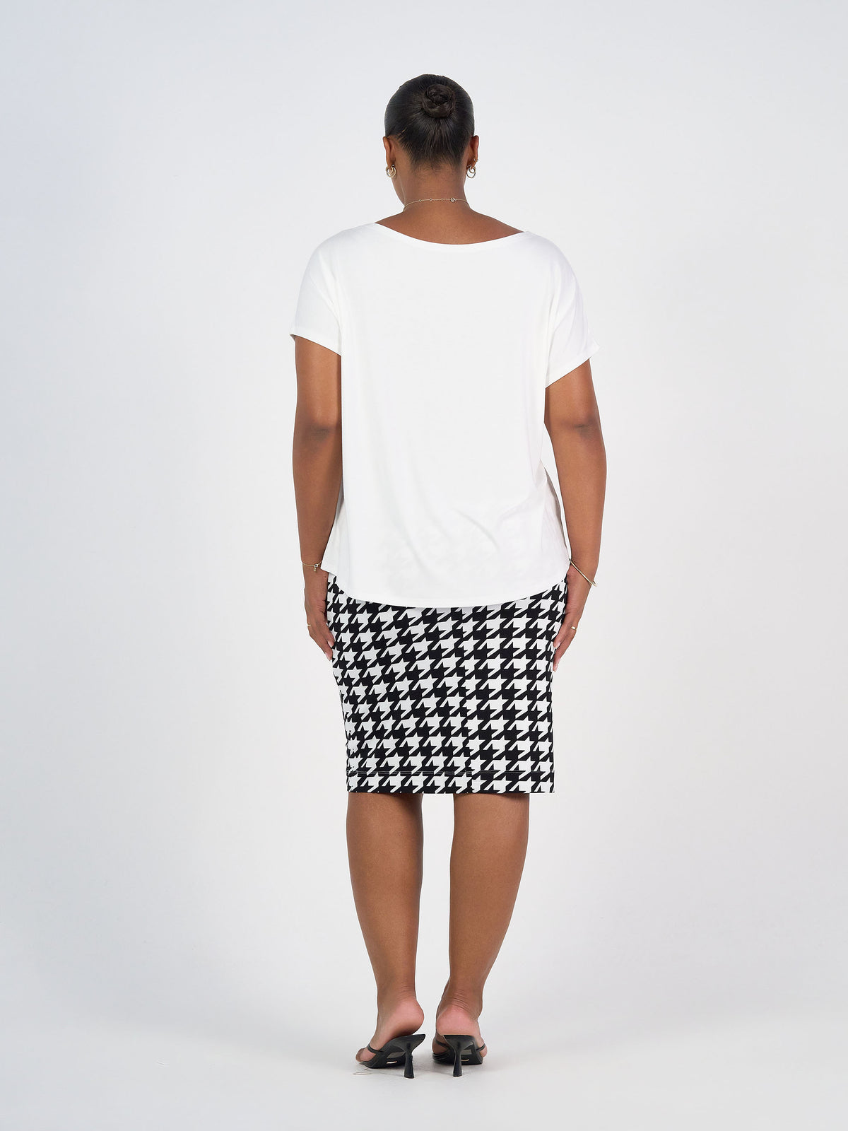 Lou Lou Australia Wilde Bamboo Box Fit Tee in Cream, made from bamboo fabric.