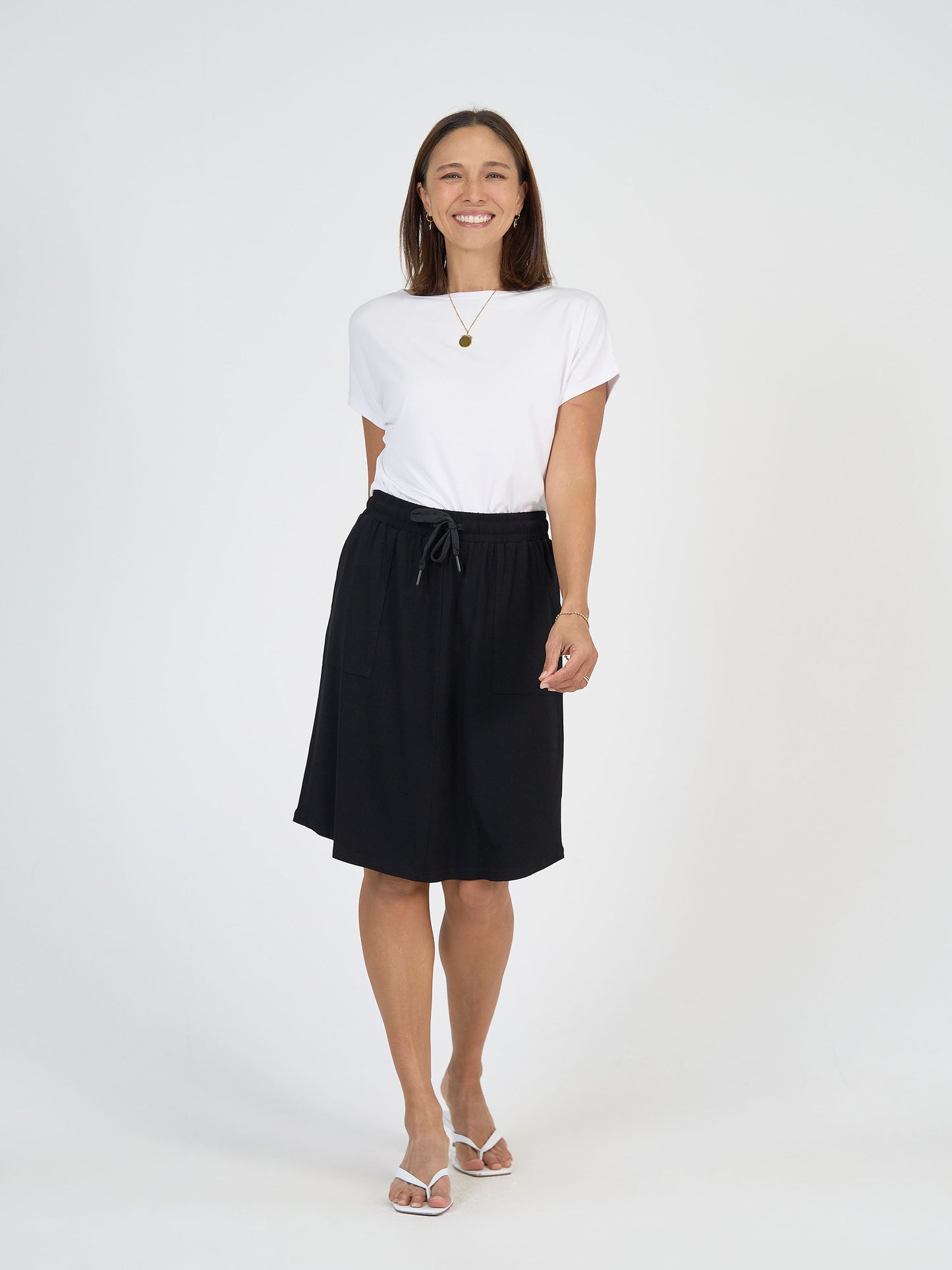 Lou Lou Australia White Bamboo T Shirt with Black Mdi length skirt with pockets 