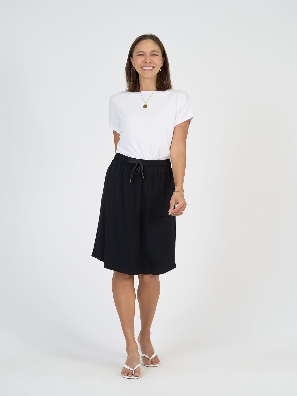 Lou Lou Australia White Bamboo T Shirt with Black Mdi length skirt with pockets 