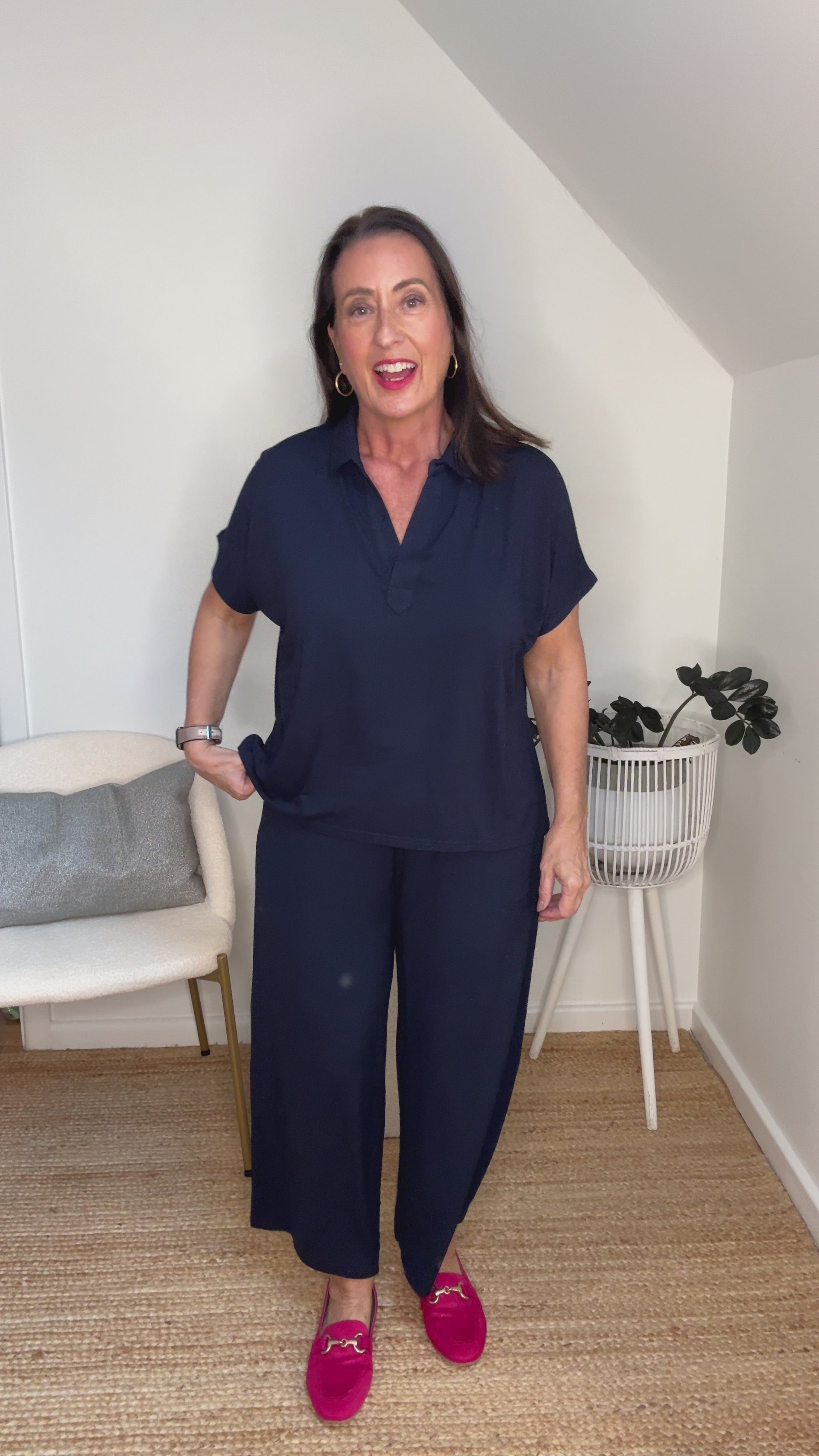 @salt.water.nomad wearing Lou Lou Australia navy bamboo polo top and culotte pants