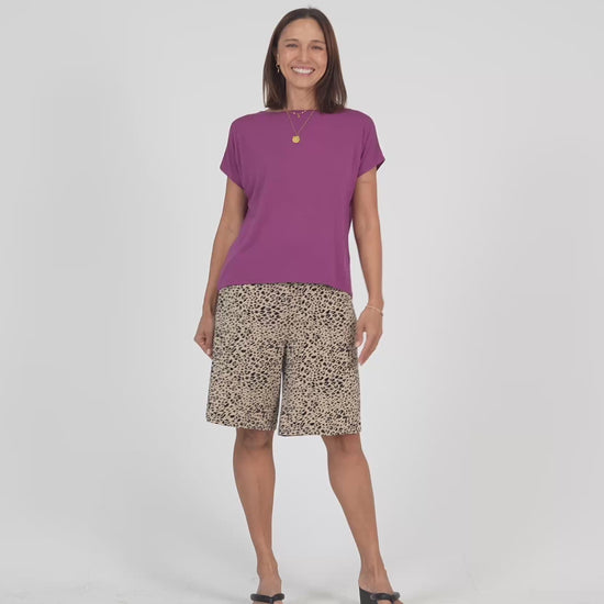 Lou Lou Australia Bamboo purple t shirt and beige leopard  knee length wide leg shorts.