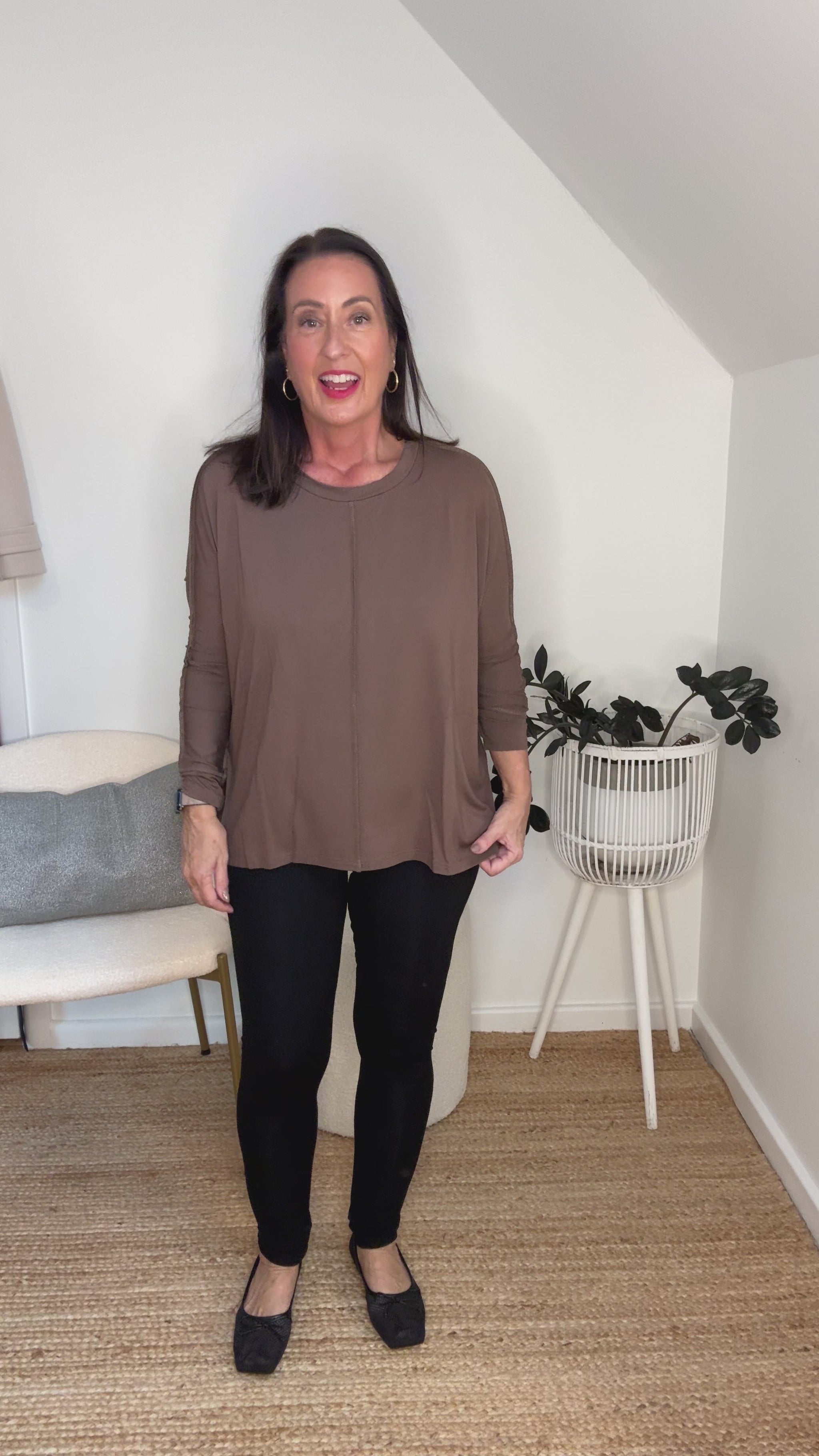 @salt.water.nomad wearing Lou Lou Australia black bamboo leggings with brown bamboo top