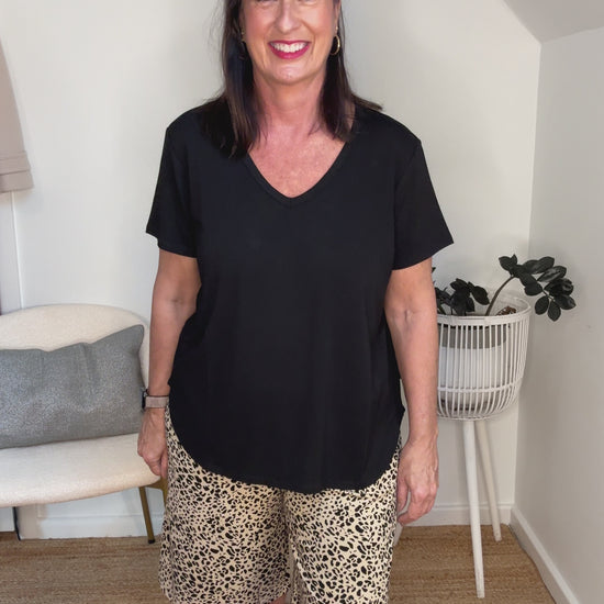 @salt.water.nomad wearing Lou Lou Australia black v-neck tee