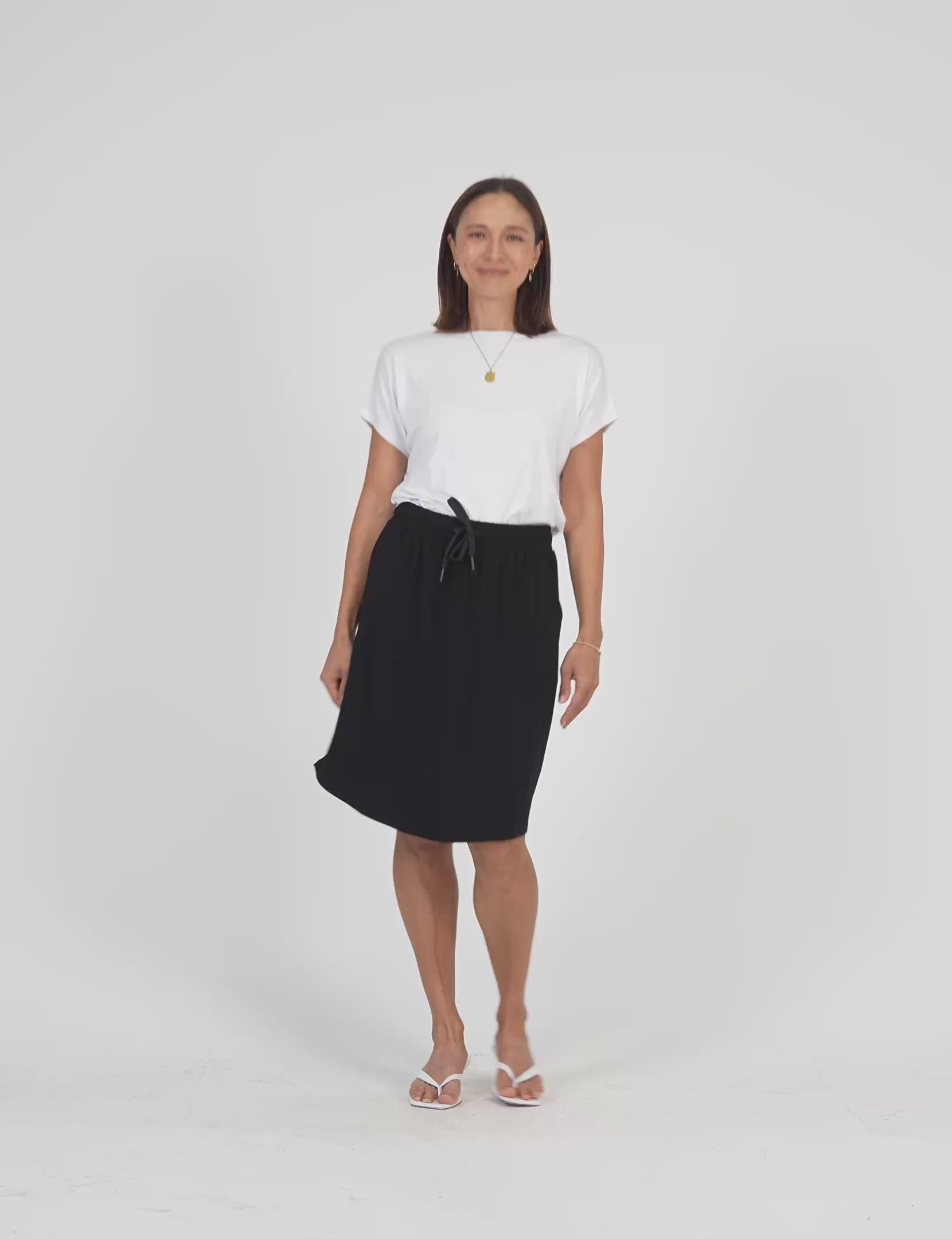 Lou Lou Australia White Bamboo T Shirt with Black Mdi length skirt with pockets 