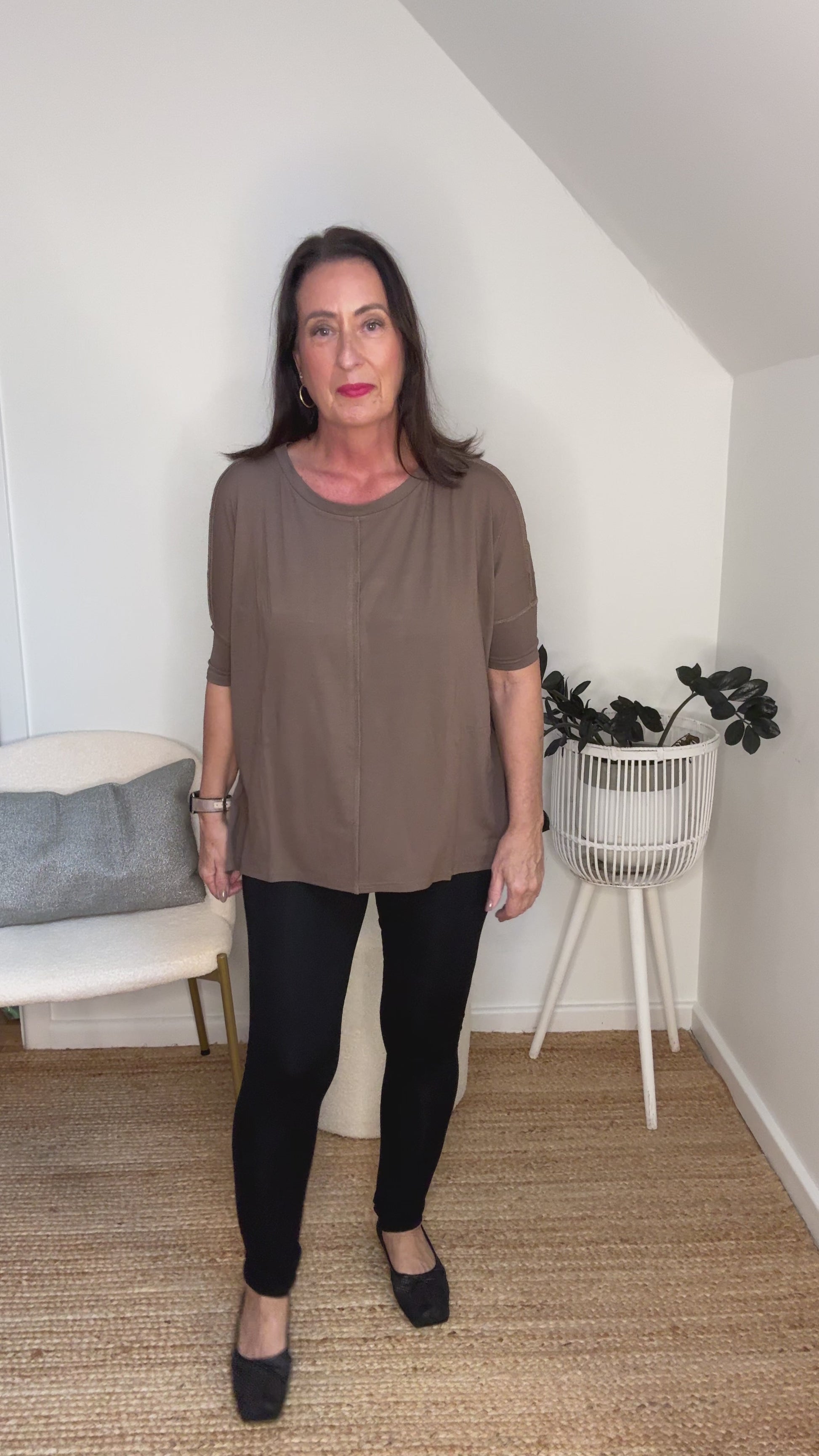 @salt.water.nomad wearing Lou Lou Australia brown bamboo top with black leggings