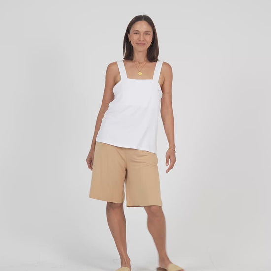 Lou Lou Australia white sleeveless top and beige tan wide leg knee length shorts 