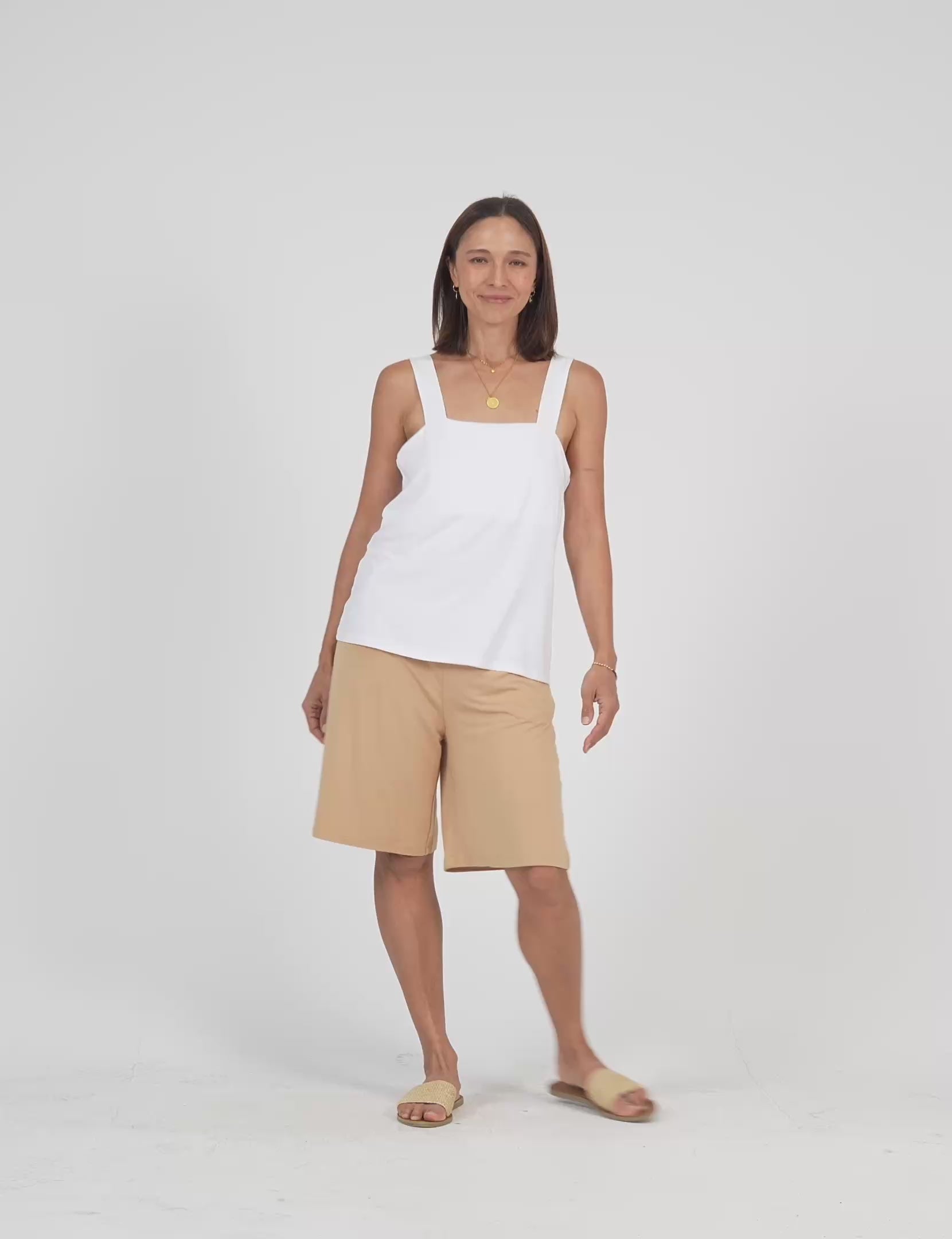 Lou Lou Australia white sleeveless top and beige tan wide leg knee length shorts 